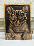 Front view of antique gold French Bulldog plaque with tongue out and paws over the frame