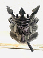 Top-down view of the lion bust showing the pointed crown and cigar