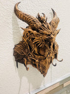 Right angle of the dragon head key holder showing horns and hook depth