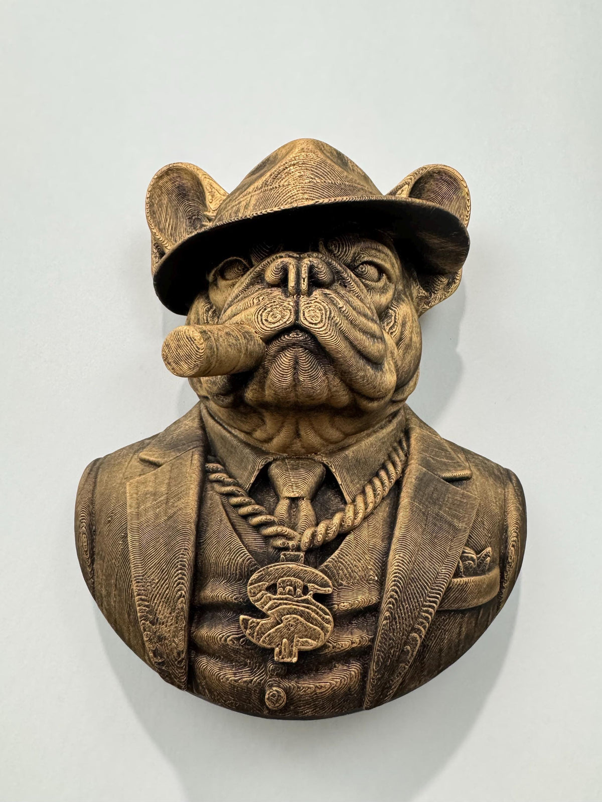 Slight angle of the Frenchie mob boss showing the cigar and gold chain medallion