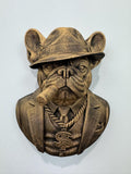 Front view of antique gold French Bulldog mob boss bust in a fedora with a cigar and chain