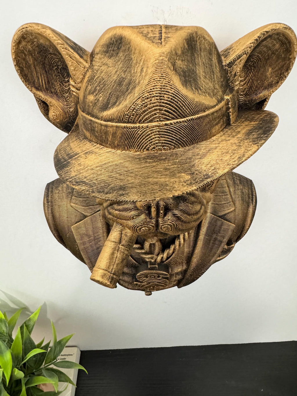 Top-down view of the French Bulldog's fedora and cigar