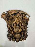 Top-down view of the skeleton queen sculpture showing the scythe blade