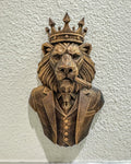 Front view of antique bronze geometric lion boss bust with crown, suit and cigar