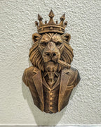 Front view of antique bronze geometric lion boss bust with crown, suit and cigar