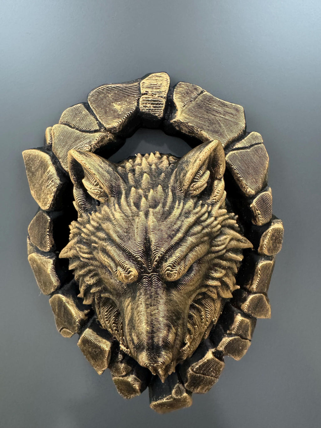 Top-down view of the wolf head showing ears and stone ring