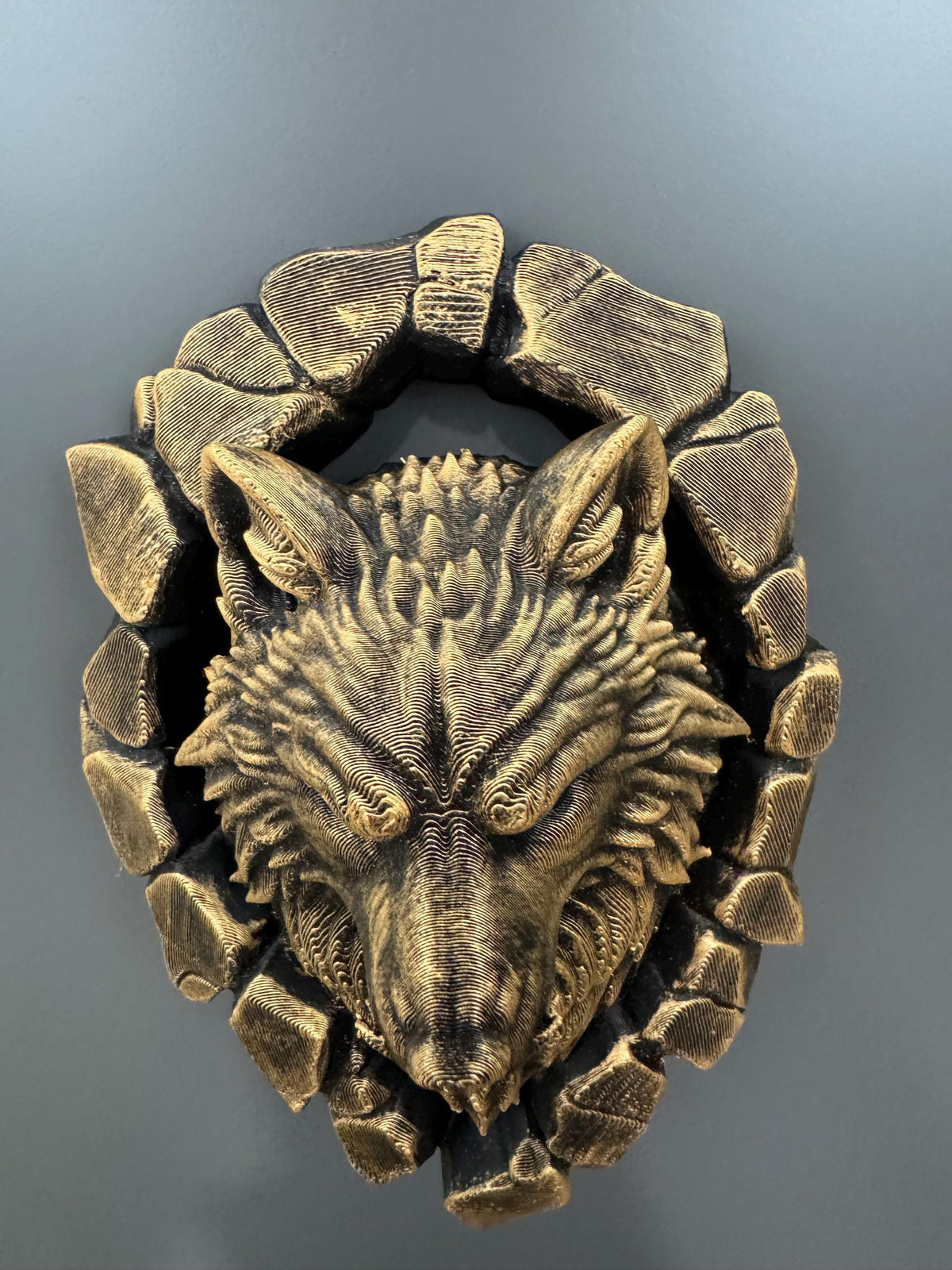 Top-down view of the wolf head showing ears and stone ring