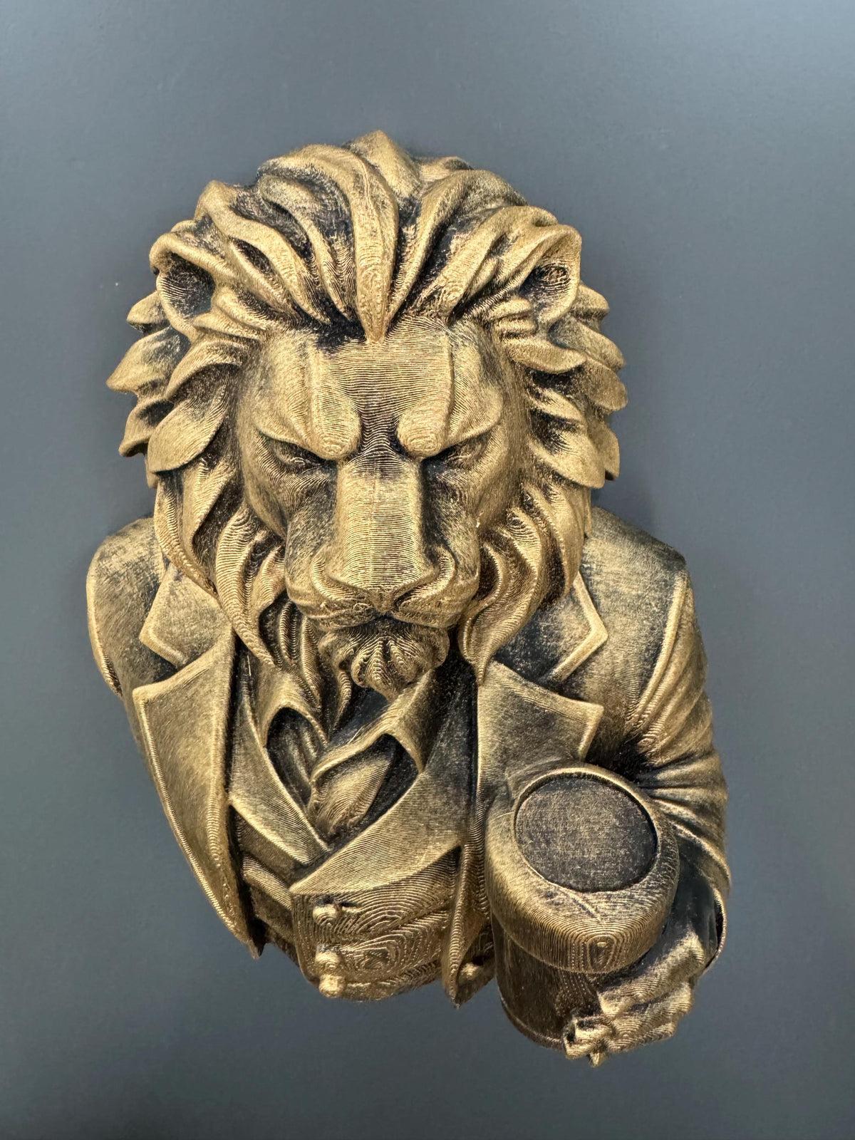 Low angle of the regal lion gentleman showing suit and glass