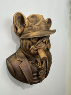 Right angle of the mob boss bulldog showing fedora brim and cigar