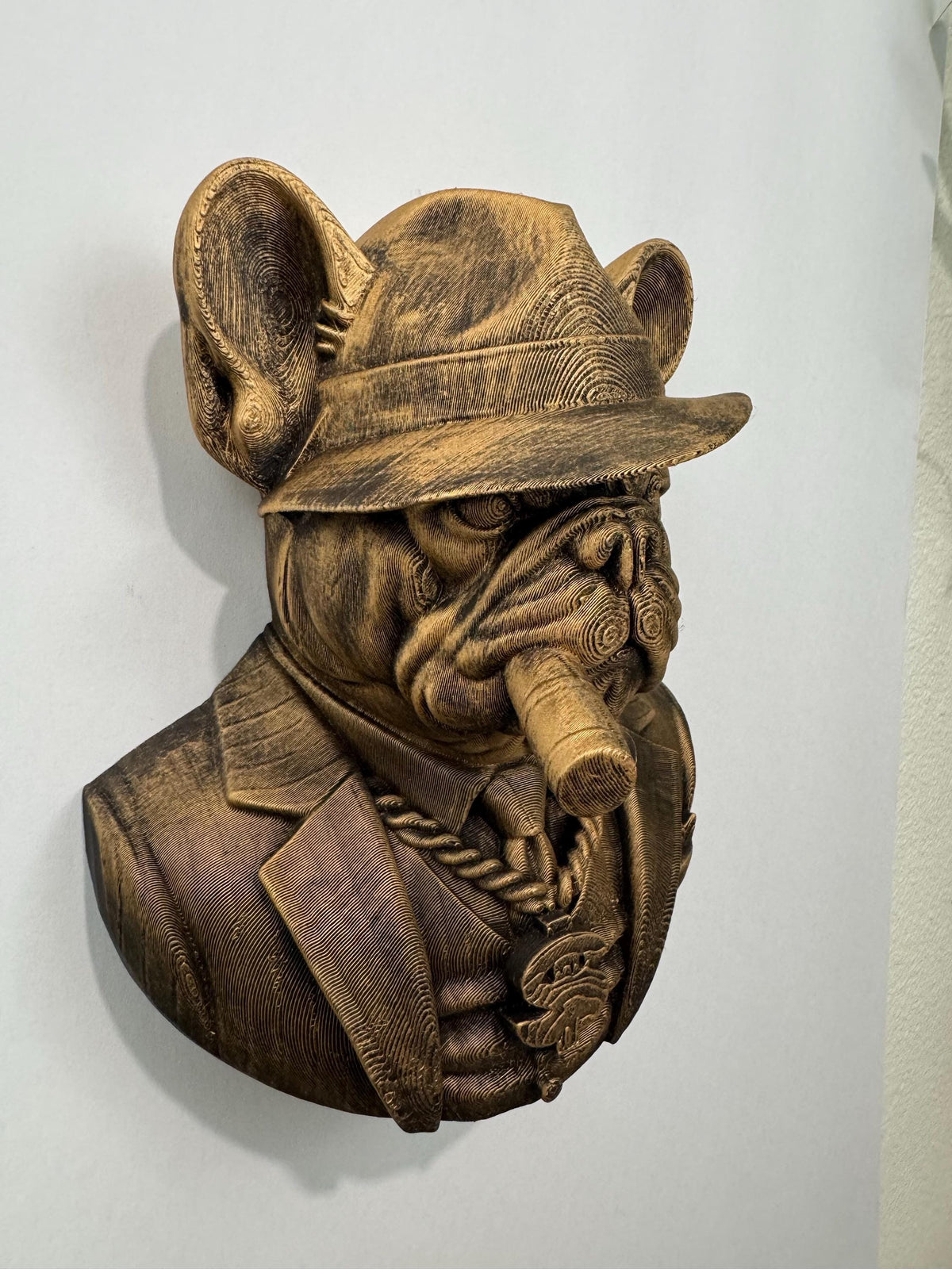 Right angle of the mob boss bulldog showing fedora brim and cigar