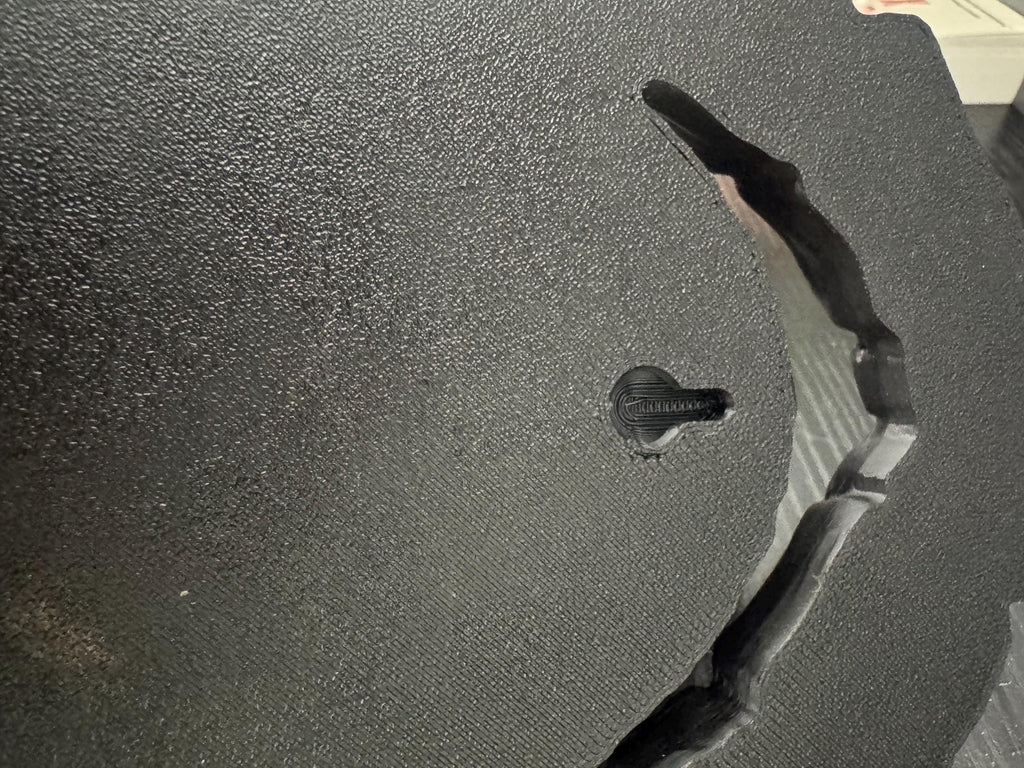 Back of the wolf sculpture showing the keyhole hanging slot