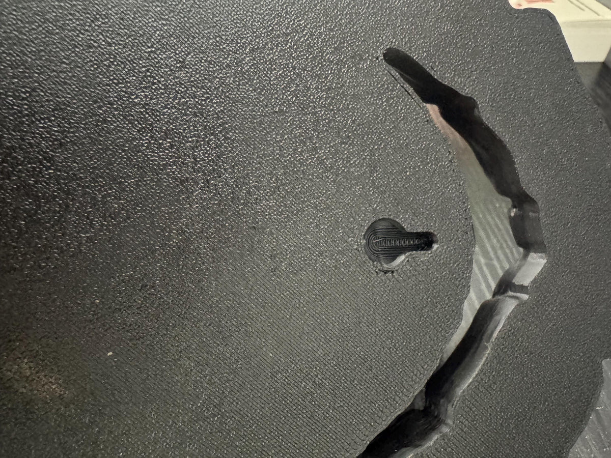 Back of the wolf sculpture showing the keyhole hanging slot