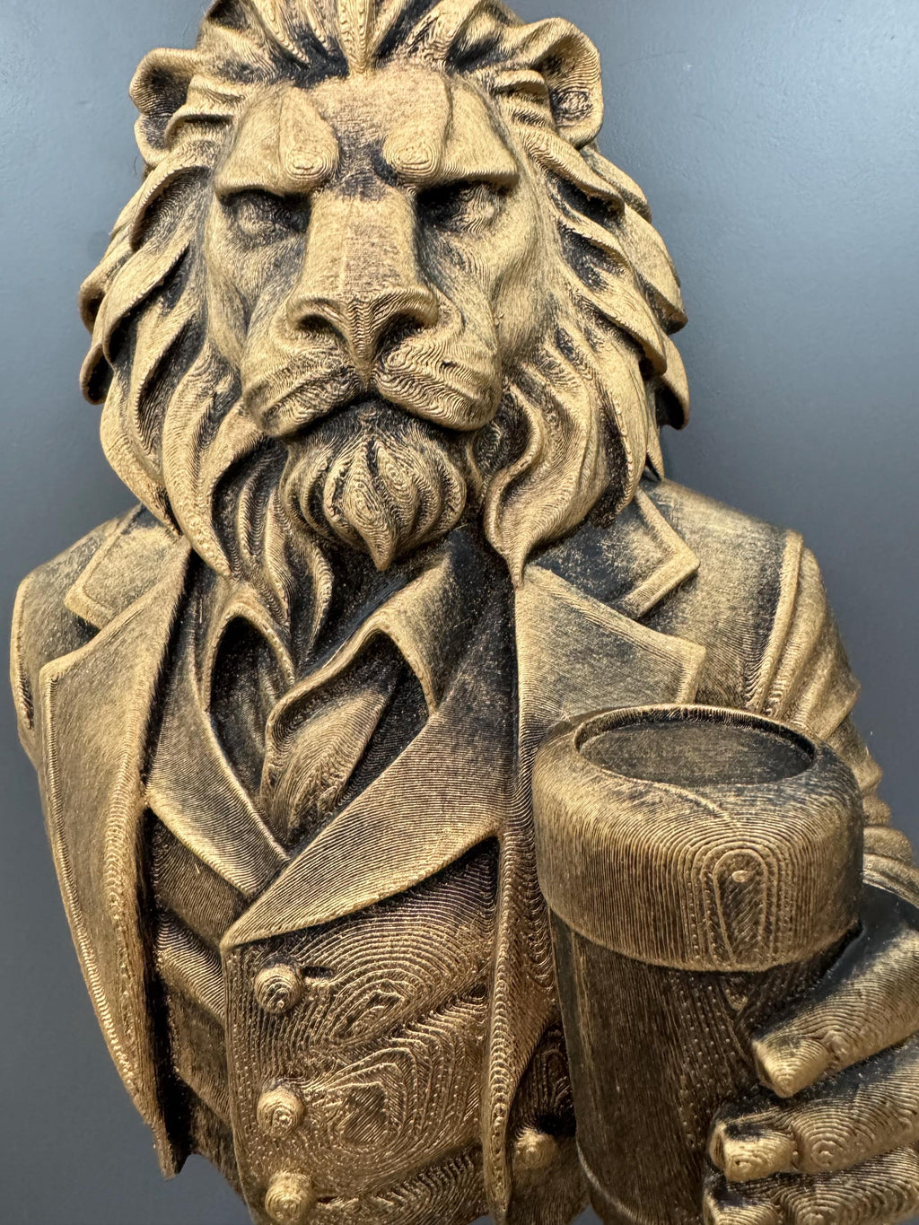 Close front view of the lion gentleman's mane, beard and glass