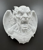 Front view of speckled stone-look winged gargoyle wall sculpture with open fanged mouth