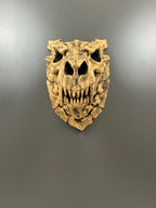 Straight-on front view of the bone-finish dragon skull showing teeth and eye sockets