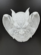 Top-down view of the gargoyle showing pointed ears, brow and wing depth