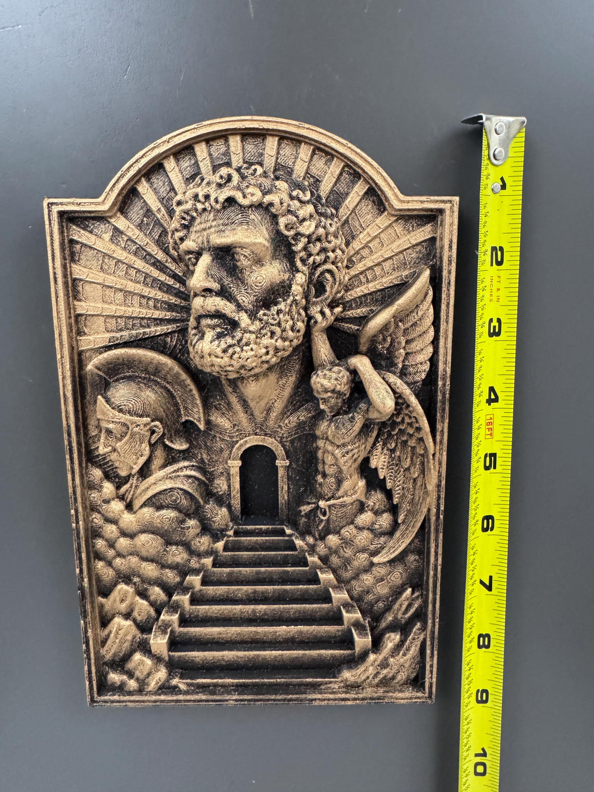 Gates of Heaven plaque beside a tape measure showing its height