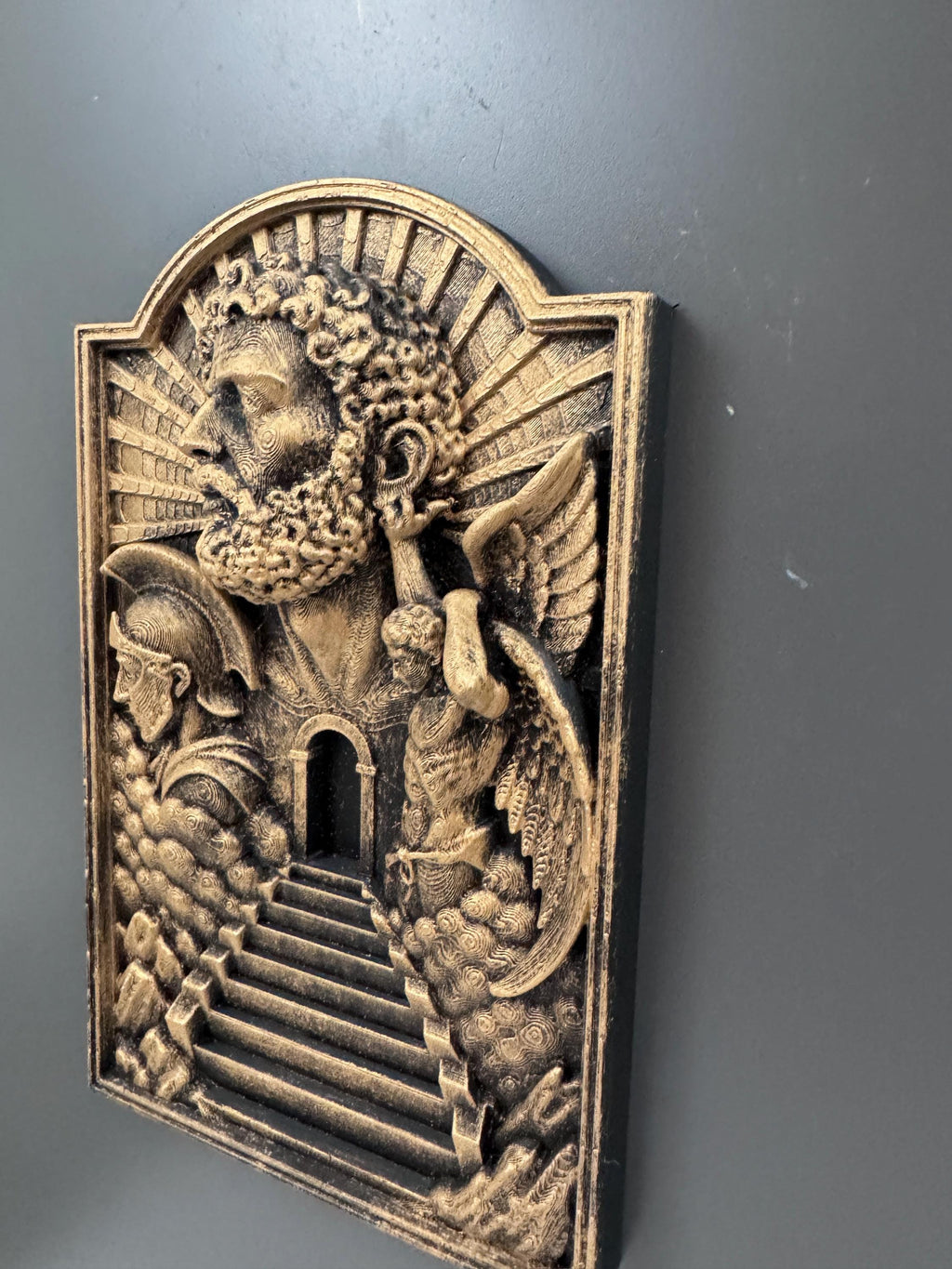 Left angle of the Gates of Heaven plaque showing relief depth