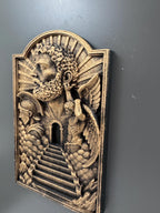 Left angle of the Gates of Heaven plaque showing relief depth