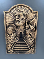 Front view of the Gates of Heaven plaque on a gray wall