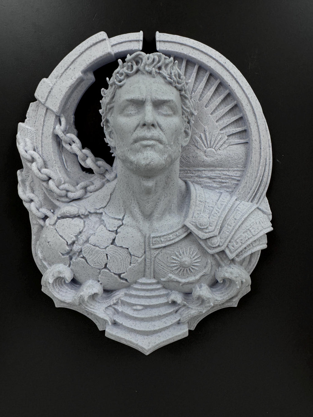 Front view of the Prometheus relief with laurel crown and falling chains