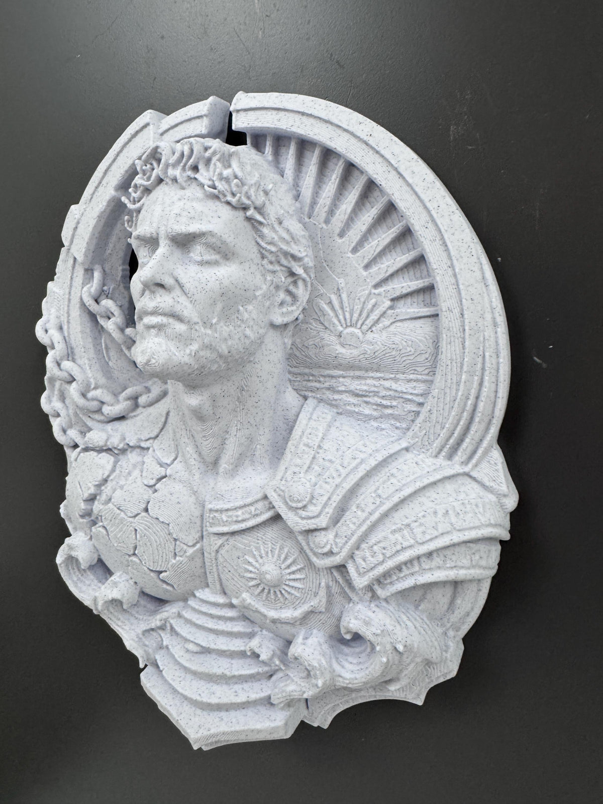 Left angle of the speckled white Titan showing shoulder armor
