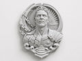 Front view of speckled white Prometheus wall sculpture with chains and fractured chest