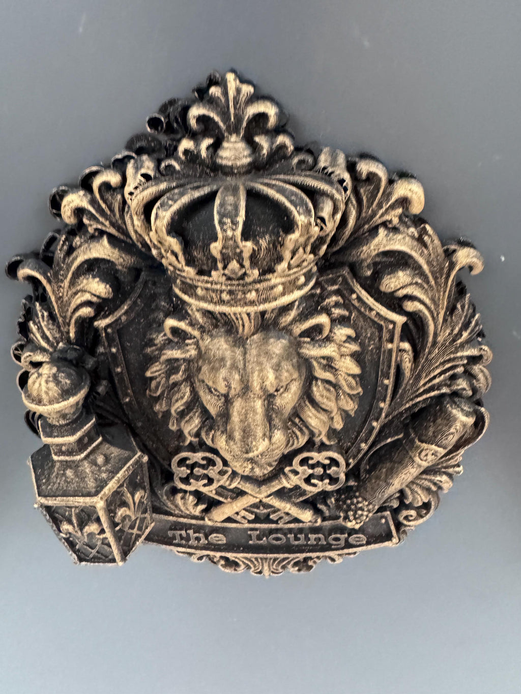 Top-down view of the lion crest showing the crown and scrollwork