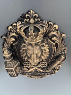 Top-down view of the lion crest showing the crown and scrollwork