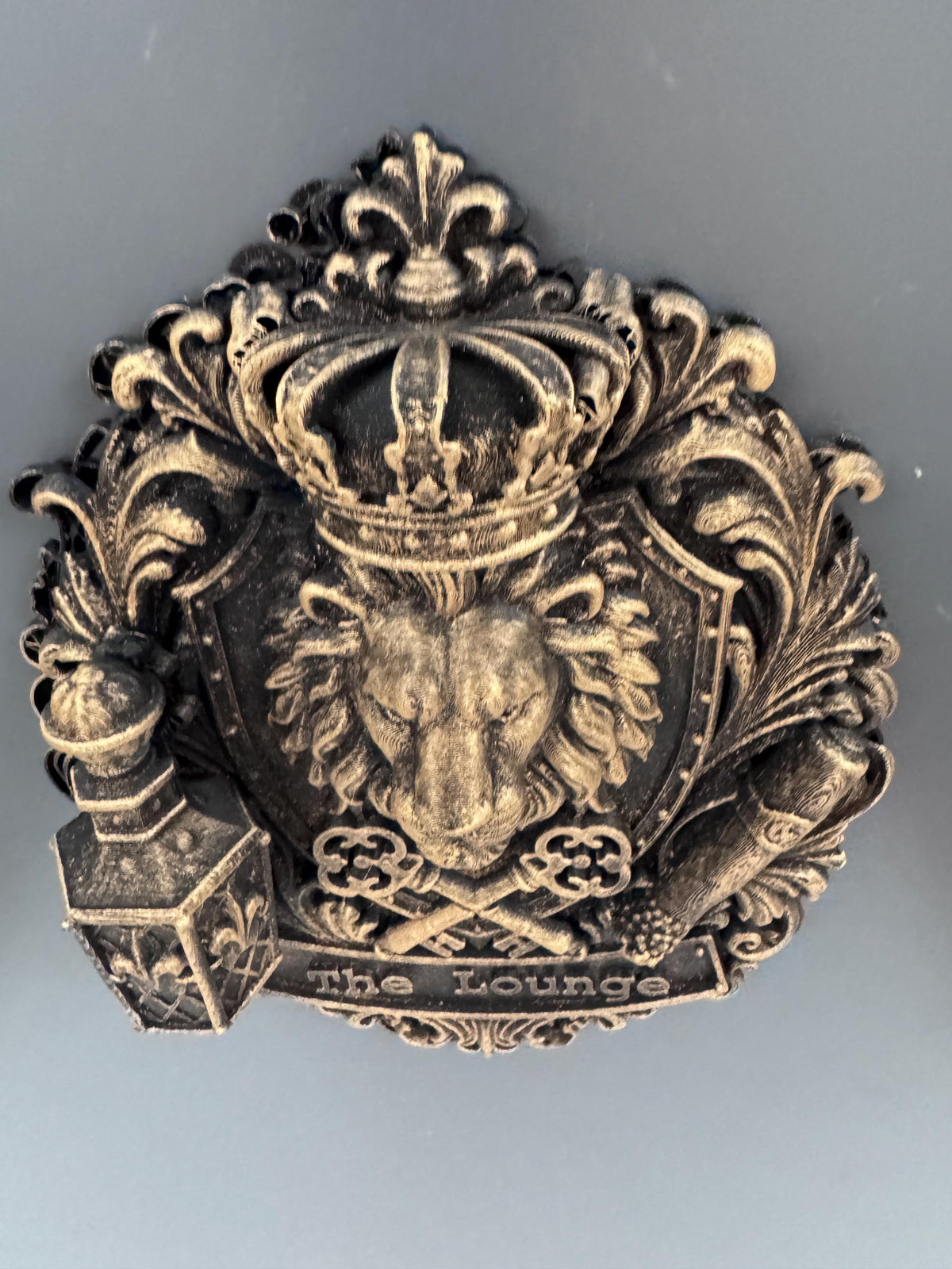 Top-down view of the lion crest showing the crown and scrollwork