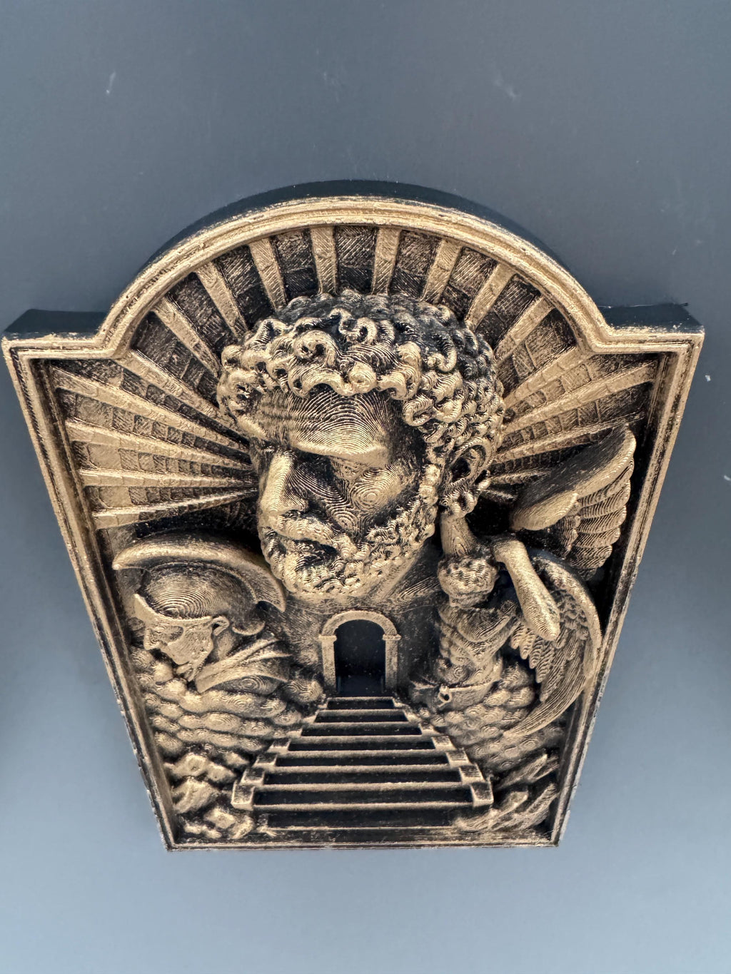 Low angle of the Gates of Heaven plaque showing the arched top