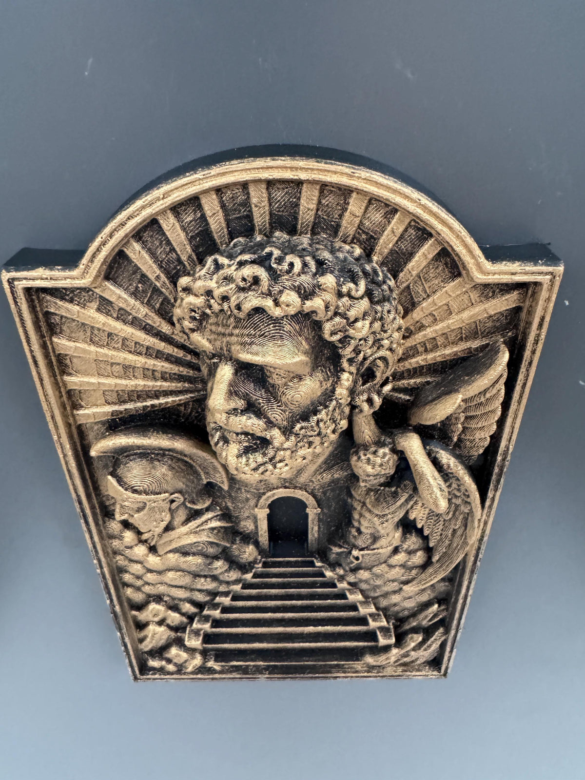 Low angle of the Gates of Heaven plaque showing the arched top