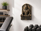 Spartan sculpture on a home gym wall beside a bench and dumbbells