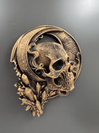 Low angle of the crescent moon skull showing the crystal cluster