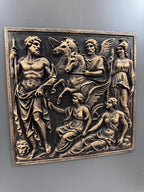 Front view of the Greek gods relief panel on a gray wall