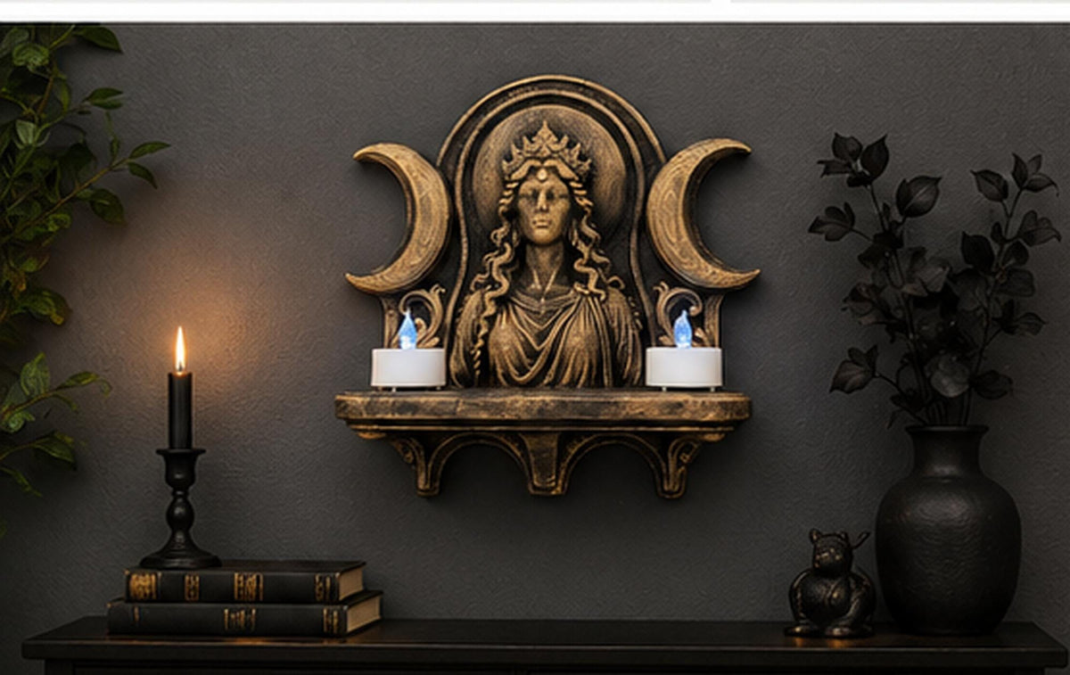 Hecate altar shelf on a dark wall holding two LED tealights beside a candlestick