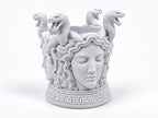 Angled view of the Medusa holder showing her calm face and snake crown