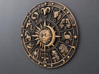 Left angle of the zodiac wheel sculpture showing relief depth
