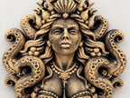 Close-up of the Siren Queen's face, pearl necklace and tentacles