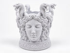 Front view of the Medusa toothbrush holder with serpents rising from the rim