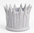 Back view of the lion holder showing carved mane strands and crown