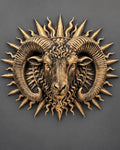 Front view of antique gold Aries ram head with curled horns inside a spiked sunburst