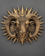 Front view of antique gold Aries ram head with curled horns inside a spiked sunburst