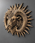 Left angle of the ram sunburst sculpture showing relief depth