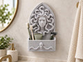 Speckled gray Medusa bathroom organizer on a wall holding toothbrushes, toothpaste and a razor
