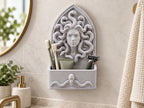 Speckled gray Medusa bathroom organizer on a wall holding toothbrushes, toothpaste and a razor