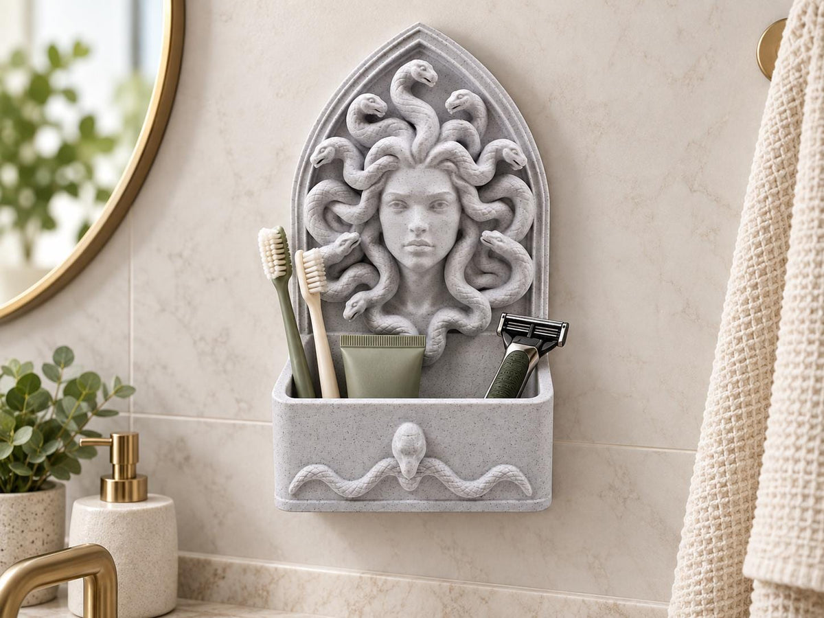Speckled gray Medusa bathroom organizer on a wall holding toothbrushes, toothpaste and a razor