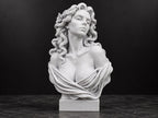 Front view of speckled white Aphrodite bust statue with wavy hair on a square base