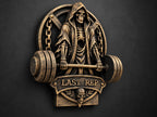 Left angle of the LAST REP reaper sculpture showing weight plate depth