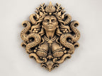 Front view of the gold sea goddess sculpture on a white background